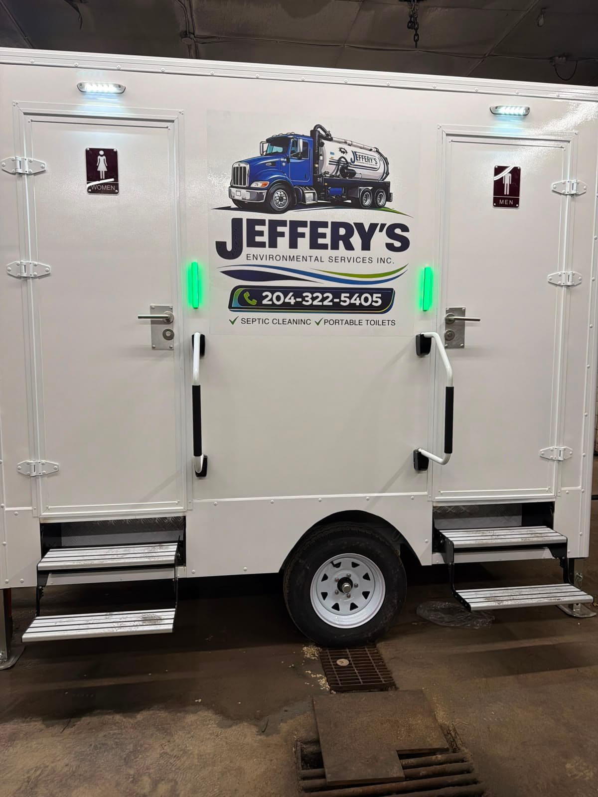 Exterior of Jeffery's luxury restroom trailer with separate entrances